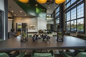 Salem apartment for rent - A modern dining room with a long table and chairs.