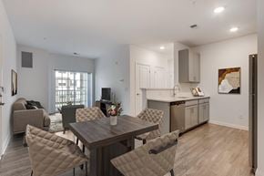 Manalapan apartment for rent - A dining room with a table and chairs.