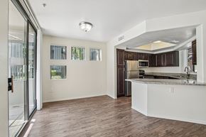 Phoenix apartment for rent - A kitchen with a white counter and brown cabinets.