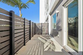 St. Petersburg apartment for rent - A wooden fence runs along the side of a building.