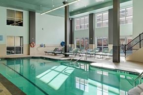Albany apartment for rent - A large indoor swimming pool with a glass bottom.
