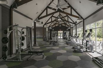 Fully-equipped fitness center with vaulted ceilings