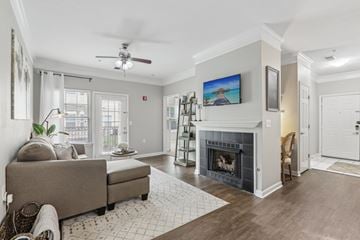 Mt Laurel apartment for rent - A living room with a grey couch and a fireplace.