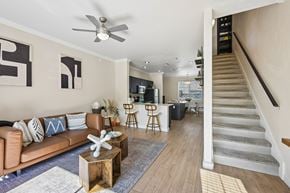 Phoenix apartment for rent - A living room with a brown couch and a wooden coffee table.