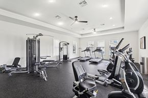 San Marcos apartment for rent - the gym has plenty of cardio equipment and dumbbells