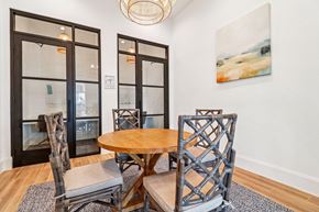 Conroe apartment for rent - A dining room with a wooden table and chairs.