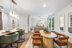 Plano apartment for rent - A modern dining room with a round table and chairs.