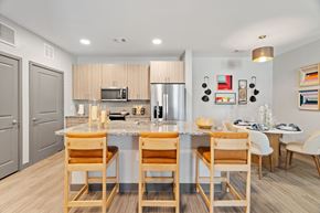 Tomball apartment for rent - A kitchen with a table and chairs.