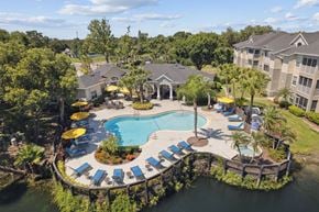 Brandon apartment for rent - An aerial view of a resort with a pool and loungers.