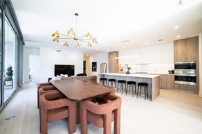 Chicago apartment for rent - a dining room and kitchen with a wooden table and chairs