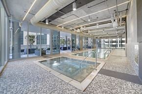 Chicago apartment for rent - a swimming pool in a building with glass walls