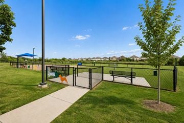 Fort Worth apartment for rent - A park with a playground and a fence.