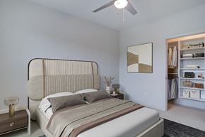 Chelmsford apartment for rent - A bedroom with a large bed and a ceiling fan.