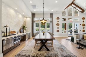 Fairburn apartment for rent - a dining room with a table and chairs in front of a window