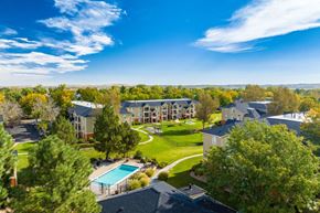 Lafayette apartment for rent - an aerial view of an apartment complex with a green lawn and a pool