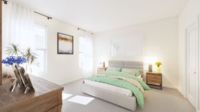 Waldorf apartment for rent - A bedroom with a large bed and a wooden dresser.