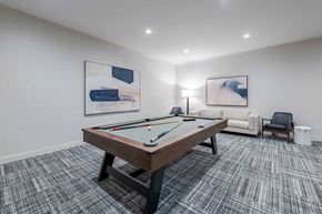 Knightdale apartment for rent - A room with a pool table and two chairs.
