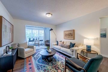 Knightdale apartment for rent - A living room with a rug and a couch.
