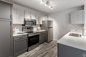 Chaska apartment for rent - our spacious kitchen is equipped with stainless steel appliances and white quartz counter tops