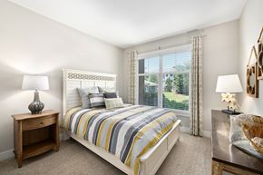 Charleston apartment for rent - A bedroom with a bed, nightstand, and window.