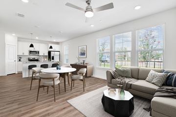 Willow Park apartment for rent - a living room with a couch and a table with chairs