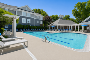 Winston Salem apartment for rent - A swimming pool with a diving board and a white pillar.