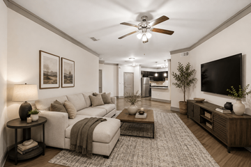 Houston apartment for rent - A living room with a white couch and a ceiling fan.
