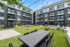 Plano apartment for rent - Big green lawn in front of a building at Markethaus 3700 in Plano Texas