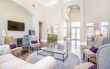 Dallas apartment for rent - a living room with couches and chairs and a glass coffee table