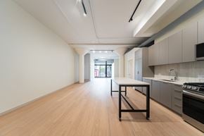 Chicago apartment for rent - A kitchen with a table and a stove.