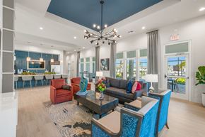 Sarasota apartment for rent - A modern living room with a large window and a view of the outdoors.