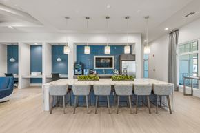 Sarasota apartment for rent - A dining room with a long table and chairs.