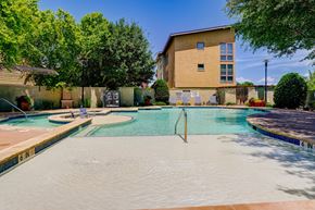 Keller apartment for rent - A swimming pool with a building in the background.