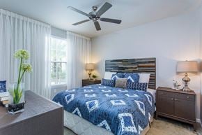 Orlando apartment for rent - a bedroom with a bed and a ceiling fan