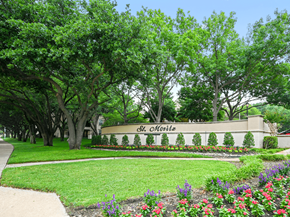 Dallas apartment for rent - a city with a sign in front of trees and flowers