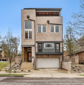 Nashville apartment for rent - A modern two-story house with a garage on the ground floor.