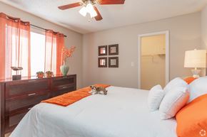 Wilmington apartment for rent - A bedroom with a bed, nightstand, and a ceiling fan.