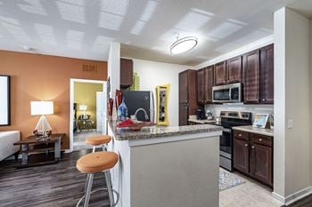 Kitchen in model home at cumberland park apartments in orlando, florida