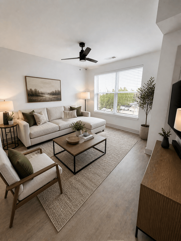 Kokomo apartment for rent - A living room with a white couch, a wooden chair, a coffee table, and a painting on the wall.