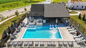 Oak Grove apartment for rent - Oak Grove, MO Pet-Friendly Apartments - Rustic Heights - Image, Pool deck with grilling station and lounge chairs.