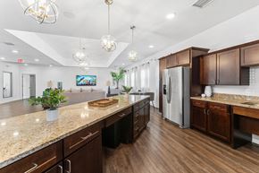 Kansas City apartment for rent - A kitchen with wooden cabinets and a granite countertop.