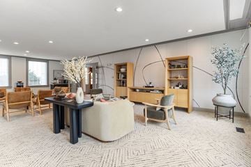 Independence apartment for rent - A living room with a black table and a white sofa.