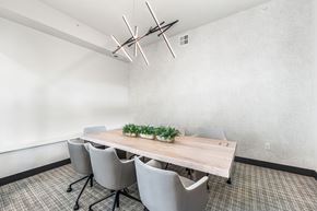 Lee's Summit apartment for rent - A conference room with a long table and chairs.