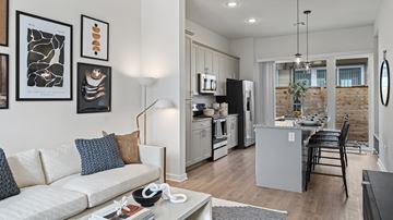 Bastrop apartment for rent - A modern living room with a white sofa and a coffee table.