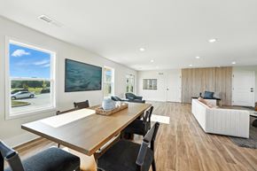 Oak Grove apartment for rent - A modern dining room with a wooden table and chairs.