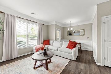 Kansas City apartment for rent - A living room with a white couch and a coffee table.