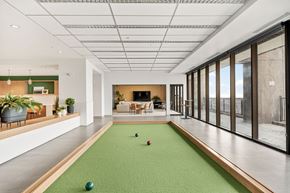 Kansas City apartment for rent - A room with a green carpet and a pool table.