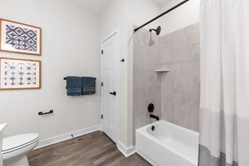 Large garden soaking shower/tubs, large mirrors, and custom vanity cabinets