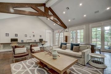 Dallas apartment for rent - A living room with a white couch and a wooden coffee table.