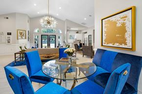 Anderson apartment for rent - A dining room with blue chairs and a glass table.